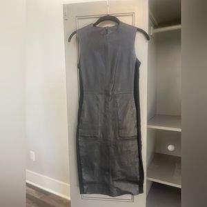 Worn twice, leather dress with side stretch panels for tight fit